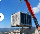 Grutage d'un groupe de climatisation sur un toit